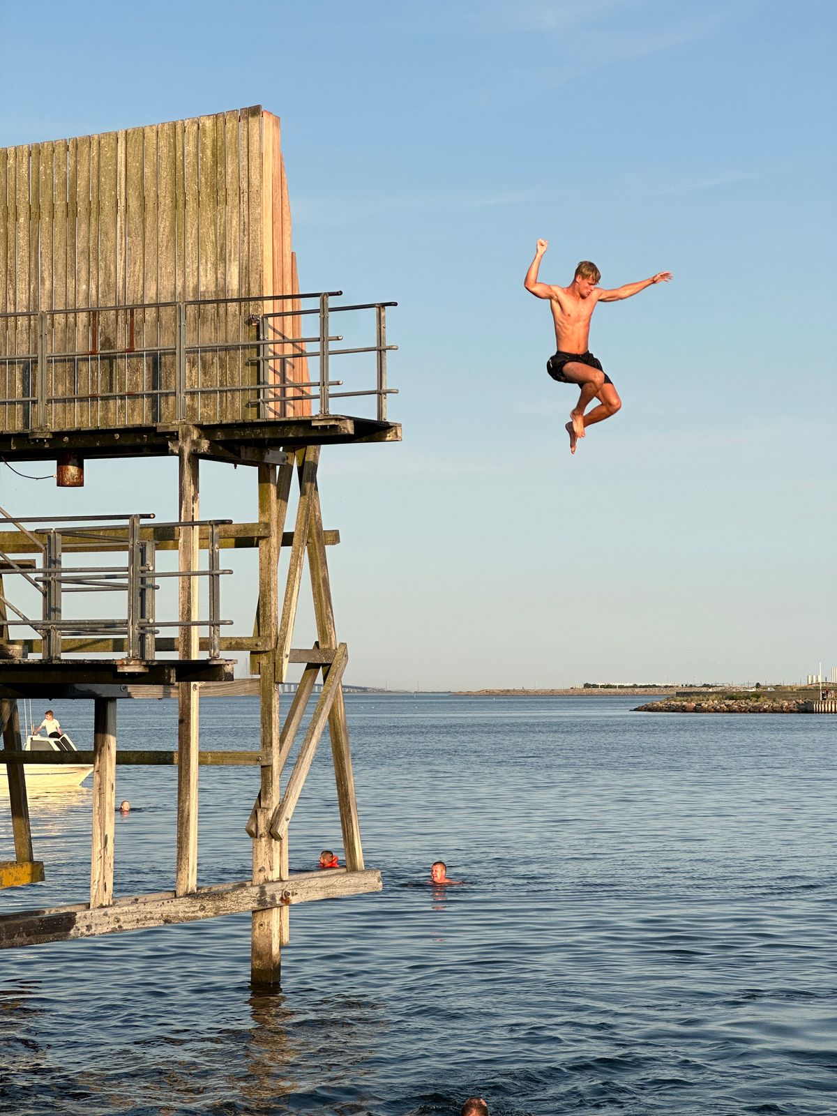 A guest mid-air, jumping into the water