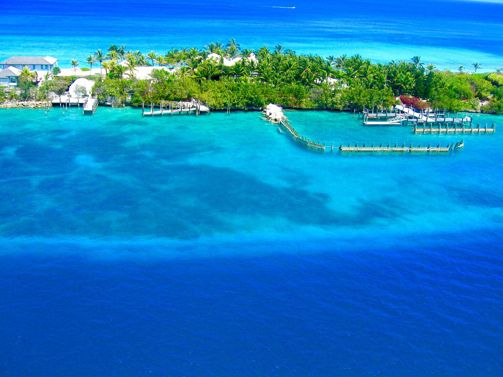 Aerial view over a bright turquoise Caribbean bay